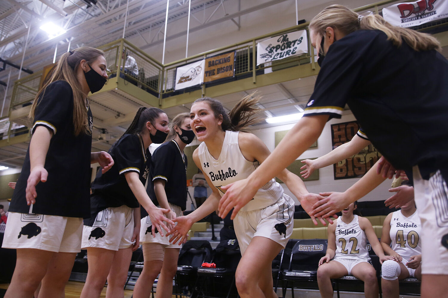 Tess Rule yells in excitement as she runs through the tunnel